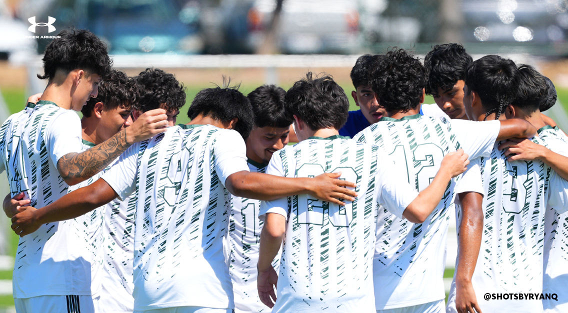 team huddle with players in white jerseys